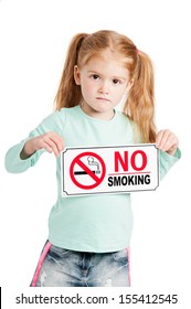 Unhappy little girl holding a no smoking sign. Isolated on white background.