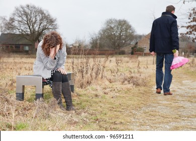 Unhappy Man Walking Away From Woman After A Huge Quarrel