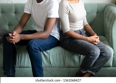 Unhappy Married African American Couple Sit On Couch Turn Back Not Talking Ignore Each Other After Fight, Stubborn Black Family Misunderstandings In Bad Marriage Relationships Concept, Close Up View