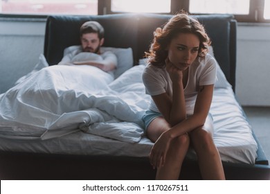 Unhappy Married Couple And Sexual Problems Concept. Frustrated Man And Woman Not Talking Feeling Offended Or Stubborn. Concept Of Impotence. Man Have Problems.