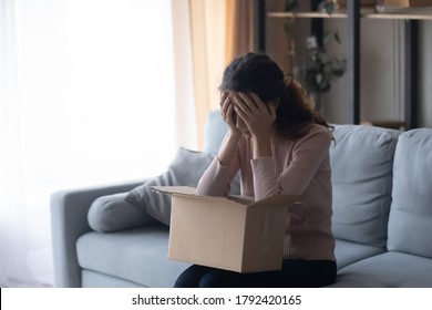 Unhappy Millennial Girl Client Unbox Cardboard Package With Internet Order Disappointed With Bad Poor Quality Or Wrong Goods, Upset Young Woman Customer Feel Frustrated Shopping Buying Online