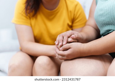 Unhappy - sad Asian woman crying and her friend try to embracing and consoling with empathy, depressed stressful fat woman crying course of mental health problem and depression. - Powered by Shutterstock