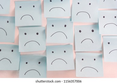 Unhappy Sad Emotion Face On Sticky Notes. Unhappy Employee Or Demotivated At working place.