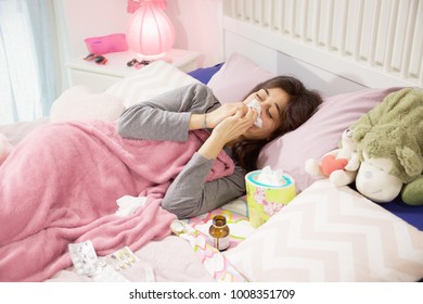 Unhappy Sick Woman In Bed At Home