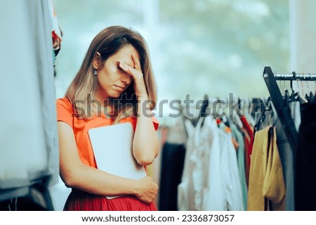 
Unhappy Store manager Holding a PC Tablet feeling Depressed. Sad business owner failing having to declare bankruptcy 
