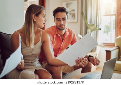 Unhappy, stressed and upset couple paying bills or debt online on with a laptop at home getting angry, planning budget. Young man and woman having a dispute over finance, savings and increasing tax - Shutterstock ID 2192921379