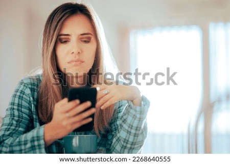 
Unhappy Stressed woman checking her Phone in The Morning
Woman receiving threats on her mobile phone feeling anxious and worried
