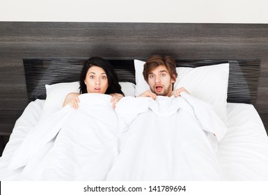 Unhappy Surprise Couple Lying In A Bed, Lovers Caught In Betrayal Cheat, Unfaithful Man And Woman Afraid Negative Emotions Concept