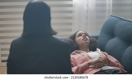 Unhappy Teen Girl Lying On Couch, Talking To Therapist, Psychological Problem