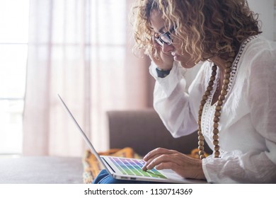 Unhappy And Ugly Beautiful Caucasian Woman Working On Laptop At Home. Alternative Office Concept For People Live In Freedom Lifestyle. Coloured Computer Keyboard And Attractive People