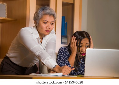 Unhappy And Upset Asian Business Woman Nagging And Scolding On Employee Girl Angry For Computer Mistake In Office Boss Or Chief Authority And Assistant Suffering Reprimand Concept