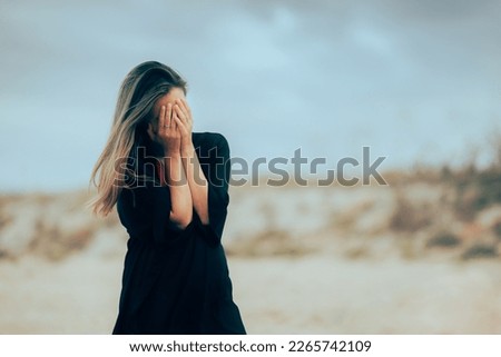 
Unhappy Woman Crying and Mourning Feeling Depressed. Desperate person going through traumatic experience feeling sorrowful
