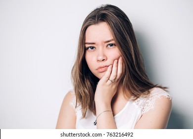 unhappy woman feel pain on her teeth isolated on white background, - Shutterstock ID 763216492
