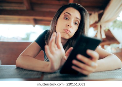 
Unhappy Woman Looking for Love Online on a Dating App. Exigent girl searching for a partner on the internet with matchmaking website
 - Shutterstock ID 2201513081