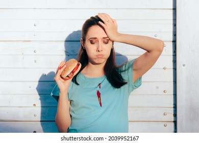 Unhappy Woman Staining Her Favorite Shirt With Ketchup Sauce 
Clumsy Young Person Spilling Tomatoes Ace All Over Her Blouse
