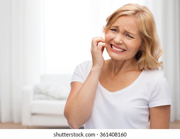 Unhappy Woman Suffering From Face Inch