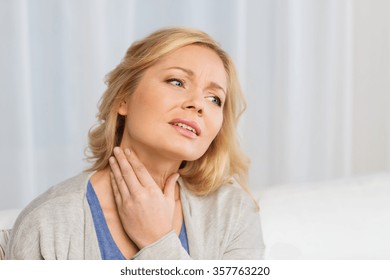 Unhappy Woman Suffering From Throat Pain At Home