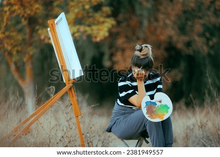 
Unhappy Woman Trying to Paint in Nature Feeling Depressed
Anxious struggling artist feeling in doubt and crying
