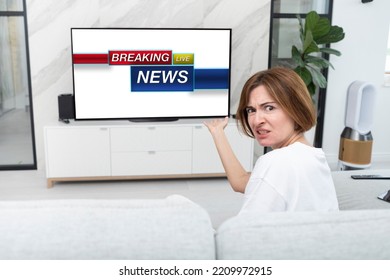 Unhappy Woman Watching TV And Feeling Irritation Because Of Bad Breaking News During Tv Series