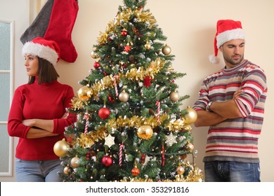 Unhappy Young Couple Arguing For Christmas Or New Year