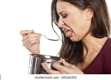 Unhappy Young Woman Is Disgusted By The Smell Of Her Food