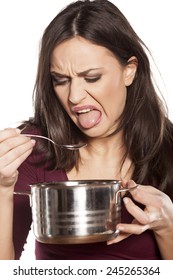 Unhappy Young Woman Is Disgusted By The Smell Of Her Food