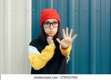 
Unhappy Young Woman Making Stop Gesture With Hand. Assertive Girl Expressing Disapproval And Rejection

