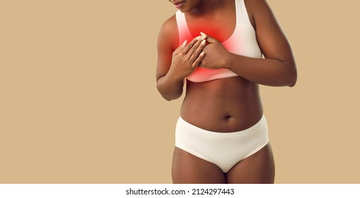 Unhealthy African American Woman In Underwear Have Pain In Chest. Unwell Ethnic Girl On Yellow Studio Background Suffer From Heart Attack Or Cardiovascular Disease. Healthcare. Copy Space.