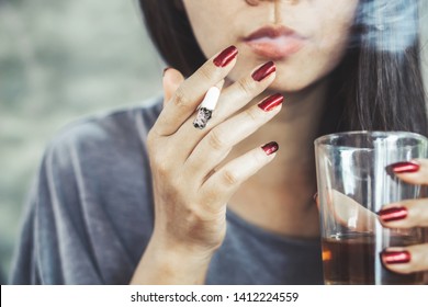 Unhealthy Asian Woman Hand Smoking Cigarette And Drinking Glass Of Alcohol 