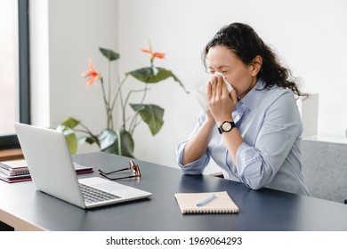 Unhealthy Caucasian Mature Businesswoman At Home Office. Sick Ill Sneezing Female Freelancer Feeling Unwell At Workplace. Sick Leave, Allergy, Respiratory Illness, Coronavirus Concept