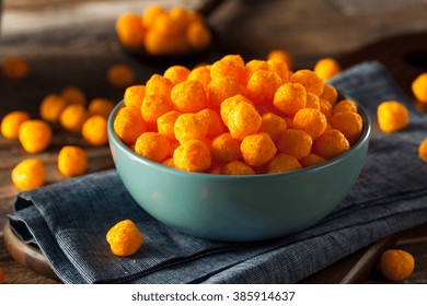 Unhealthy Cheesy Cheese Puffs In A Bowl