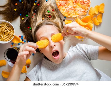 Unhealthy Concept. Woman With Unhealthy Food: Pizza, Lemonade, Chips, Candy And Chips.