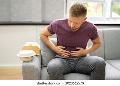 Unhealthy Fastfood Stomach Heartburn. Person After Eating Food