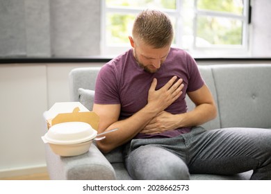 Unhealthy Fastfood Stomach Heartburn. Person After Eating Food