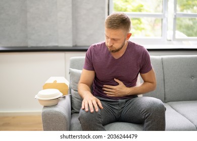 Unhealthy Fastfood Stomach Heartburn. Person After Eating Food