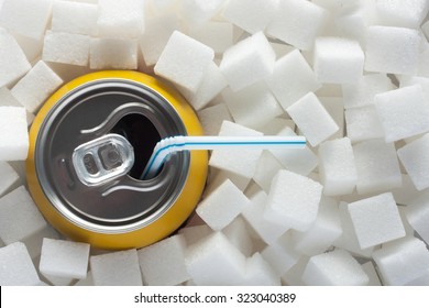 Unhealthy Food Concept - Sugar In Carbonated Drink. Sugar Cubes As Background And Canned Drink With Straw Drink