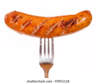 Unhealthy grilled barbecue sausage isolated on white background