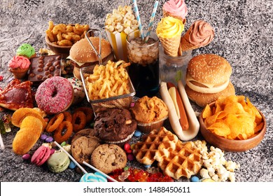 Unhealthy products. food bad for figure, skin, heart and teeth. Assortment of fast carbohydrates food with fries and cola - Shutterstock ID 1488450611