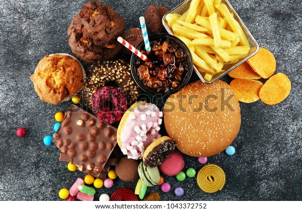 Unhealthy products. food bad\
for figure, skin, heart and teeth. Assortment of fast carbohydrates\
food. 