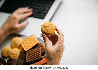 Unhealthy Snack At Workplace. Hands Of Woman Working At Computer And Taking Cookies From Plate. Bad Habits, Junk Food, High Calorie Eating, Weight Gain And Lifestyle Concept