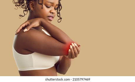 Unhealthy young African American woman struggle with ache in arm. Pain in elbow or cubit. Unwell sick black ethnic female suffer from inflammation in hand, have arthritis. Healthcare and medicine. - Powered by Shutterstock