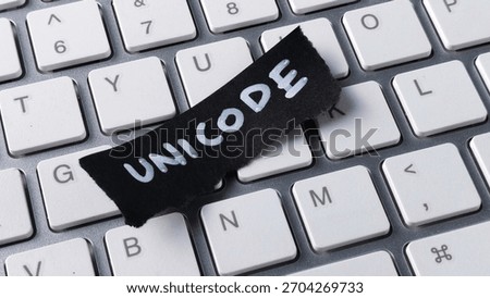Unicode Encoding Standard Concept with Black Paper Note on Computer Keyboard Keys for Programming and Global Communication