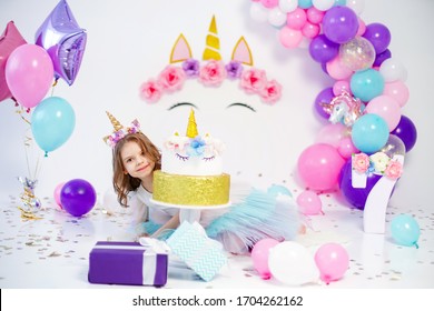 Unicorn Girl Posing Near Happy Birthday Cake. Idea For Decorating Unicorn Style Birthday Party. Unicorn Decoration For Festival Party Girl.