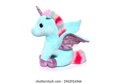 Unicorn Plush Toy Sitting. Isolated On White Background 