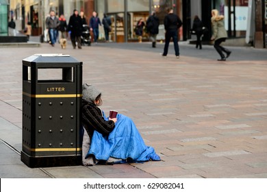 An Unidentifed Person Begging On A Street In Glasgow, Scotland.