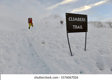 Unidentifiable climbers on snow covered Mount Hood in early Spring
