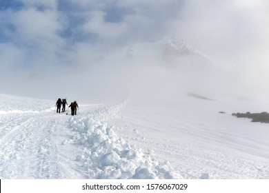 Unidentifiable climbers on snow covered Mount Hood in early Spring