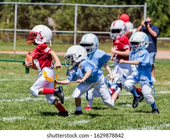 Unidentifiable kids playing American flag football