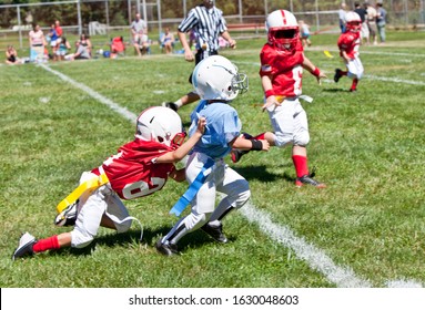 Unidentifiable kids playing American flag football