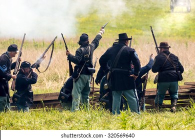 Unidentifiable union soldiers fight during the reenactment of the Civil War Battle of Gettysburg.